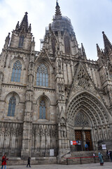 Fototapeta na wymiar Barcelona, Spain - 23 Nov, 2021: Main entrance of the Gothic Cathedral of The Holy Cross and Saint Eulalia - Barcelona, Catalonia, Spain