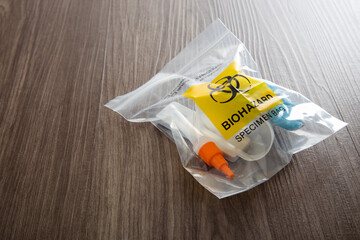 Covid-19 Rapid Antigen Test kit and biohazard specimen bag. Concept of waste separation - obrazy, fototapety, plakaty