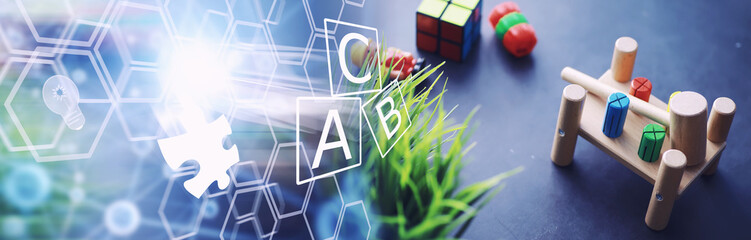 Children's development. Children's wooden toy on the table in the play area. Room of children's creativity and self-development. Wooden constructor.