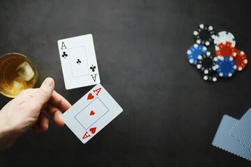 The concept of card tricks and presentations. The concept of a sharpie in games. Flying cards in the air. A magician raises cards with the power of thought.