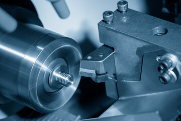The  CNC lathe machine thread cutting at the end metal stud parts. - obrazy, fototapety, plakaty
