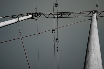 High voltage tower with power lines. View from bottom to on the top of tower's voltage