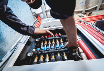 HVAC technician servicing home heating and cooling system