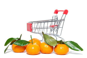 fresh mangerines and a shopping cart on a white isolated background