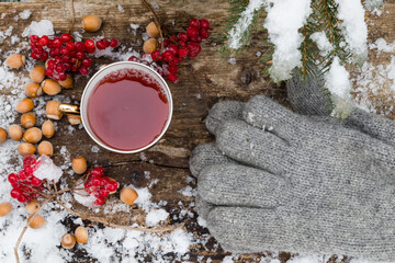 tea in a cup on a blackboard in the snow