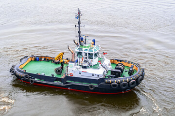 A small tugboat, photographed from the height of a quadcopter. Aerial drone photo of tug boat...