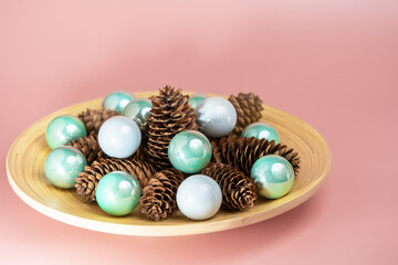Cones and Christmas balls in a plate
