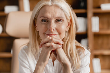 Close up portrait of a confident caucasian mature middle-aged businesswoman tutor teacher boss ceo...