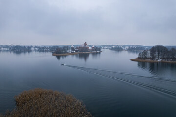 Fototapeta premium Aerial winter snowy view of Trakai Island Castle