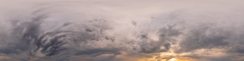 Overcast sky panorama on sunset with Cumulus clouds in Seamless spherical equirectangular format as full zenith for use in 3D graphics, game and aerial drone 360 degree panoramas for sky replacement.