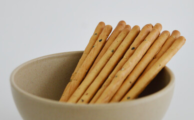 Close up photo of sesame seeds sticks, a Korean vegan snack