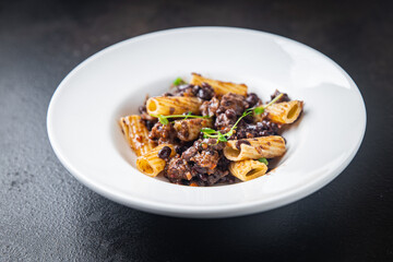 fagioli pasta with beans rigatoni or tortiglioni Italian food healthy meal diet snack on the table copy space food background rustic. top view