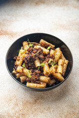 fagioli pasta with beans rigatoni or tortiglioni Italian food healthy meal diet snack on the table copy space food background rustic. top view