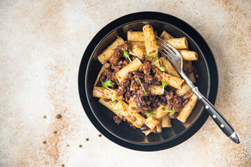 fagioli pasta with beans rigatoni or tortiglioni Italian food healthy meal diet snack on the table copy space food background rustic. top view