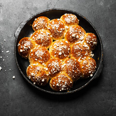 Sugar buns. Delicious dessert on a dark background. Top view