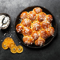 Sugar buns. Delicious dessert on a dark background. Top view