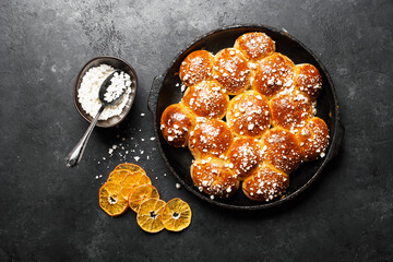 Sugar buns. Delicious dessert on a dark background. Top view