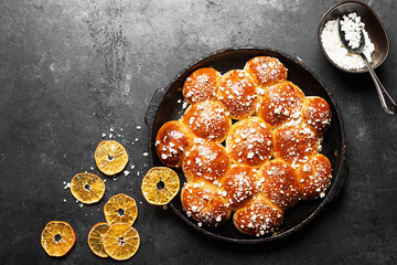 Sugar buns. Delicious dessert on a dark background. Top view