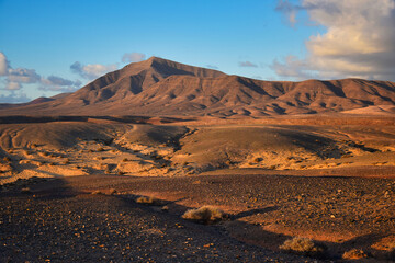 Costa de Papagayo on a sunny evening. The mountain range Los Ajaches in the background. Lanzarote, Spain.