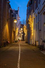 Old street in the city center from Deventer in the Netherlands at sunset