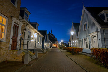 Old dutch wooden houses in Friesland the Netherlands by night in christmas time