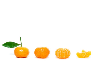 Pile of mandarins with leaf isolated on white background