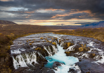 Colorful sunset at the Bruarfoss waterfall in south Iceland  with blue water