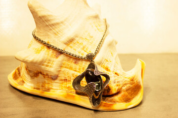 cheap jewelry chain bracelet and ring blackened from water on white background.