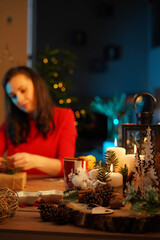 Charming lady packing the Christmas presents for family members