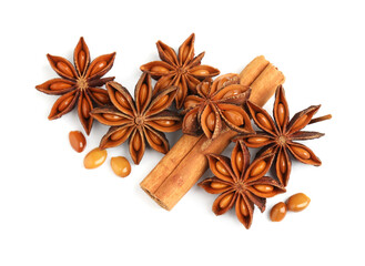 Fototapeta na wymiar Dry anise stars and cinnamon stick on white background, top view