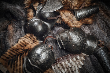 Shot of antique nordic armour and equipment on fur