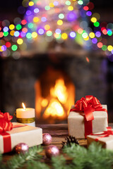 Christmas Tree and Christmas gift boxes in the interior with a fireplace