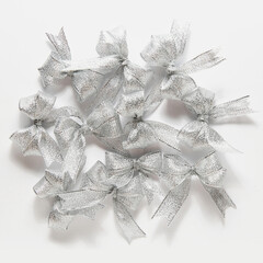 multiple silvery festive bows background