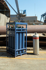 Industrial lpg cylinder and blue oxygen cylinders.