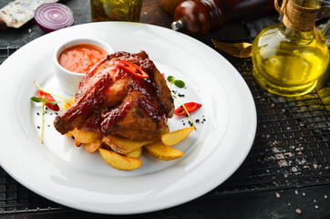 Chicken leg baked in honey sauce with potatoes. Restaurant dish. Menu. Top view.