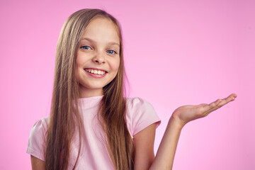 cute girl with long hair on pink background lifestyle childhood