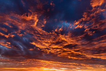 Colorful cloudy sky at sunset. Dramatic sunset sky with clouds. Sky texture, nature background.
