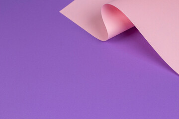 Abstract wave of pastel pink and purple paper. Creative geometric curved paper with light and shadows. Abstract geometry background with copy space