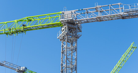 Naklejka premium construction crane at blue sky background