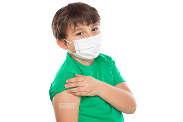 Child kid with plaster after Coronavirus vaccination wearing face mask against Corona Virus...