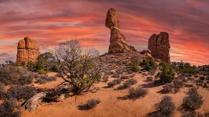 balanced rock in arches national park with clouds