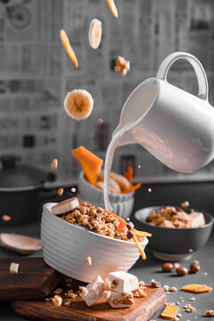 Musli with milk and fruits levitating objects
