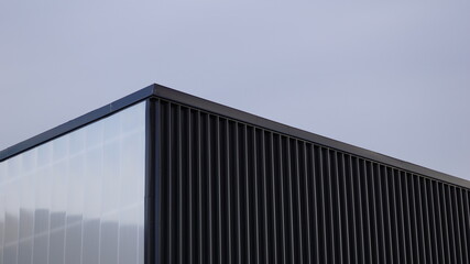 Fototapeta na wymiar modern building rooftop against sky