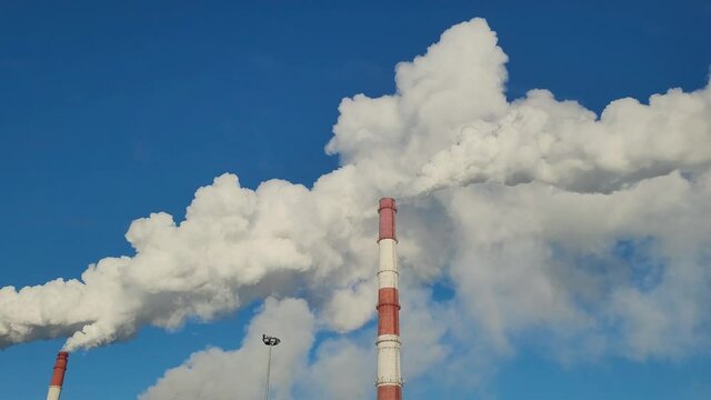 Industrial, ecology and environmental pollution. The smoke from the chimney of the industrial plant.	
