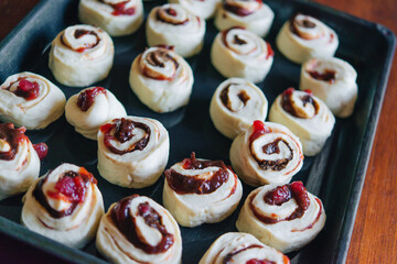 Making yeast buns with jam and chocolate. Handmade homemade cakes.