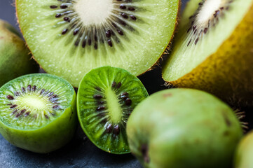 fresh yellow kiwi fruits on a slate plate