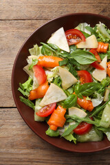Delicious turnip salad served on wooden table, top view