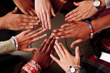 Palms up hands of happy group of multinational African, latin american and european people which...