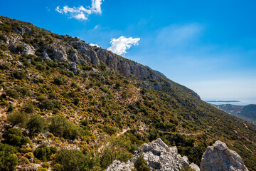 Fototapeta premium Lycian way hiking and trekking route, path, road in Mediterranean area with rocks, mountains. Mountain landscape image taken on the Lycian way trek in Turkey 