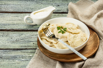 Dumplings with cottage cheese and sour cream